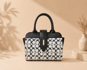 white blck bag Black and white monogram pattern structured handbag for women with black faux leather top handles and gold hardware